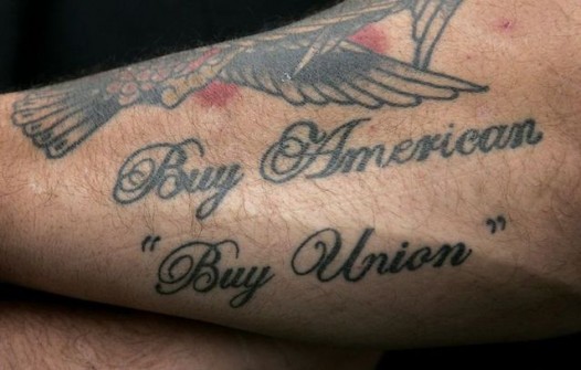 United Auto Workers union local 594 president Don Skidmore shows his ‘Buy American Buy Union’ tattoo on his arm outside his union local 735 in Canton, Michigan