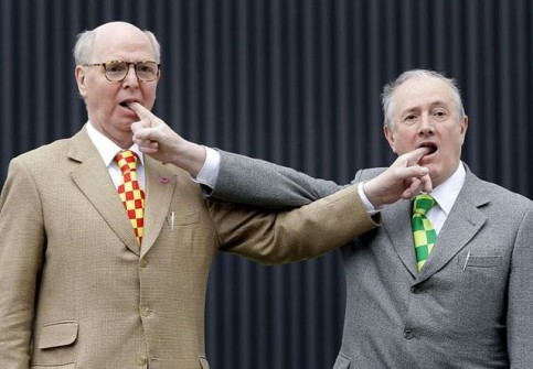 British artists Gilbert and George pose before news conference on latest show in Berlin