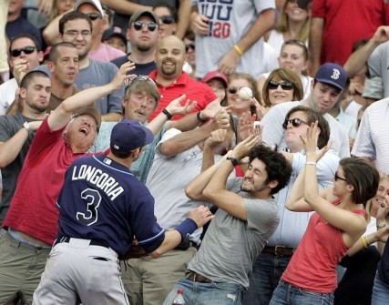 Tampa Bay Rays Longoria watches fans attempt to catch a fouled pop up hit by Boston Red Sox Ortiz in Boston