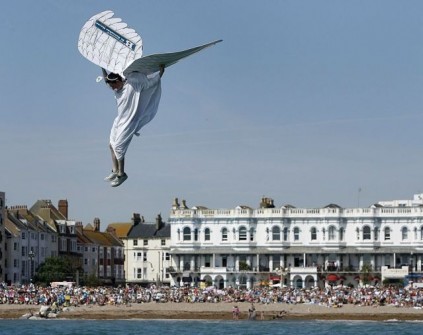 A competitor takes part in the Worthing International Birdman competition in Worthing, southern England