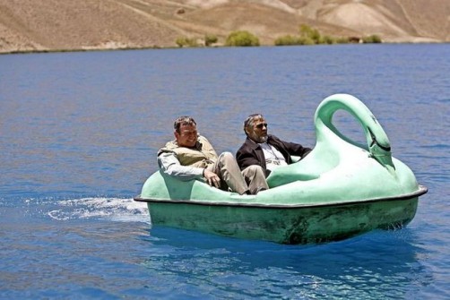 U.S. ambassador Karl W. Eikenberry and Afghan Minister of Urban Development Mohammad Yosouf Pashtun ride in a paddle boat on the Band-e-Amir lake, in Bamiyan province
