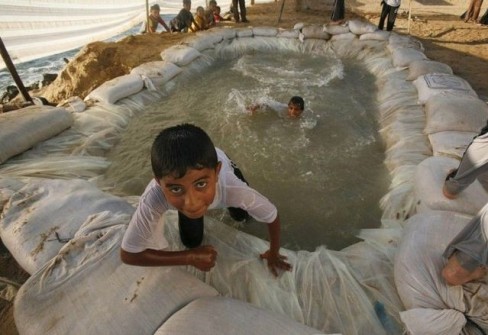Palestinian children take part in a summer camp organised by the Hamas movement in Shati refugee camp in Gaza City