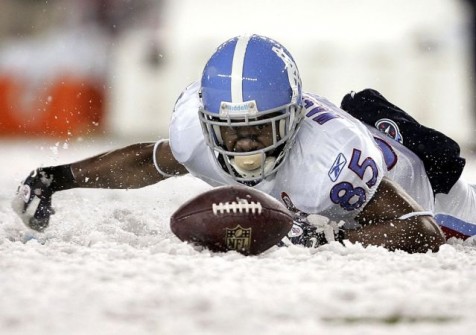Washington scrambles in the snow to recover a fumble against the Patriots in the third quarter of their NFL football game in Foxborough