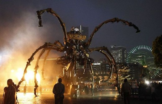 A giant mechanical spider performed by French company La Machine walks along waterfront in Yokohma
