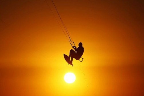 An Israeli man kite surfs in Ashkelon